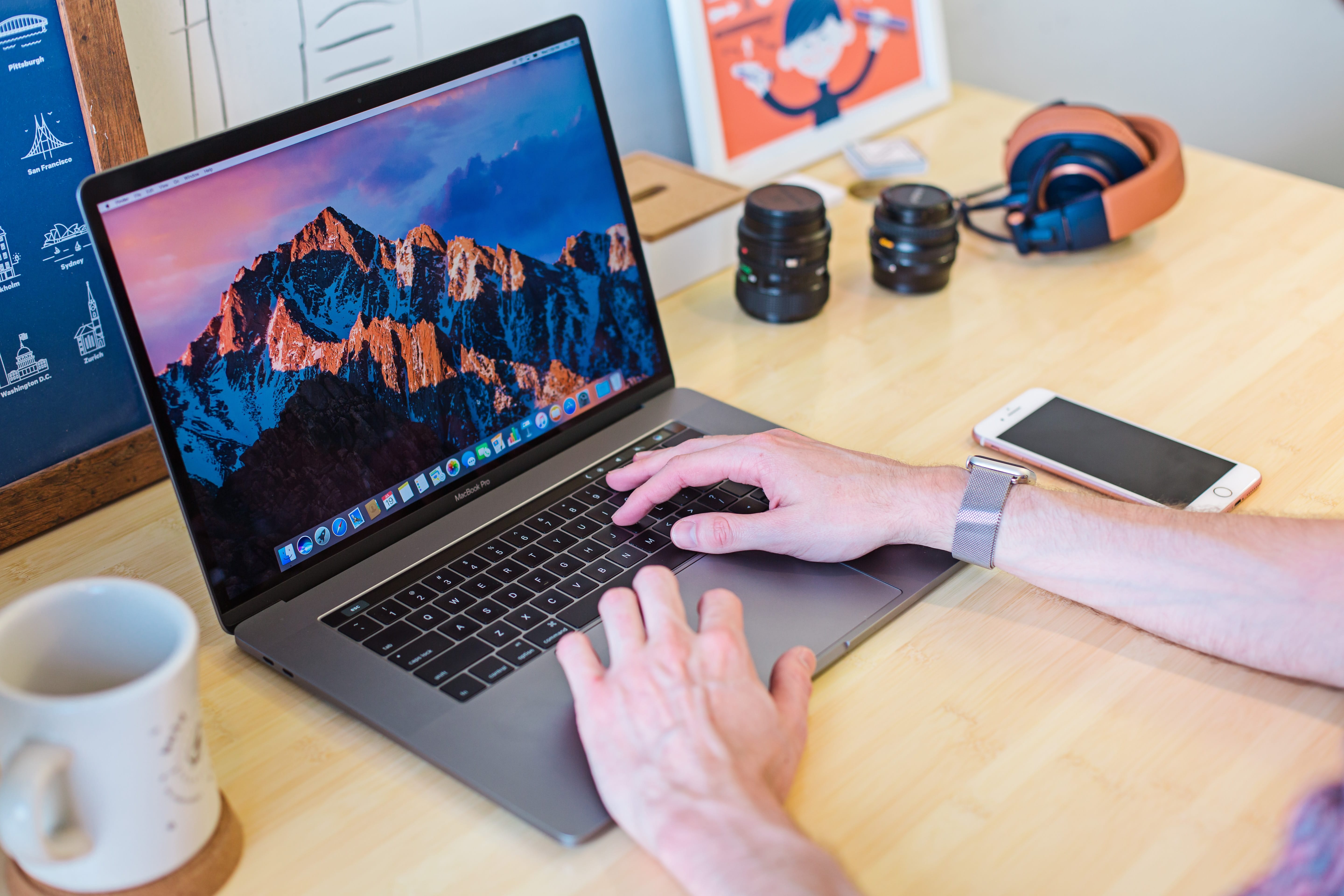 Man on MacBook with Cyber Security